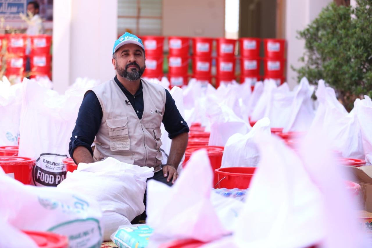 Minhaj Welfare Foundation distributing hygiene kits along with food bags in flood-hit areas