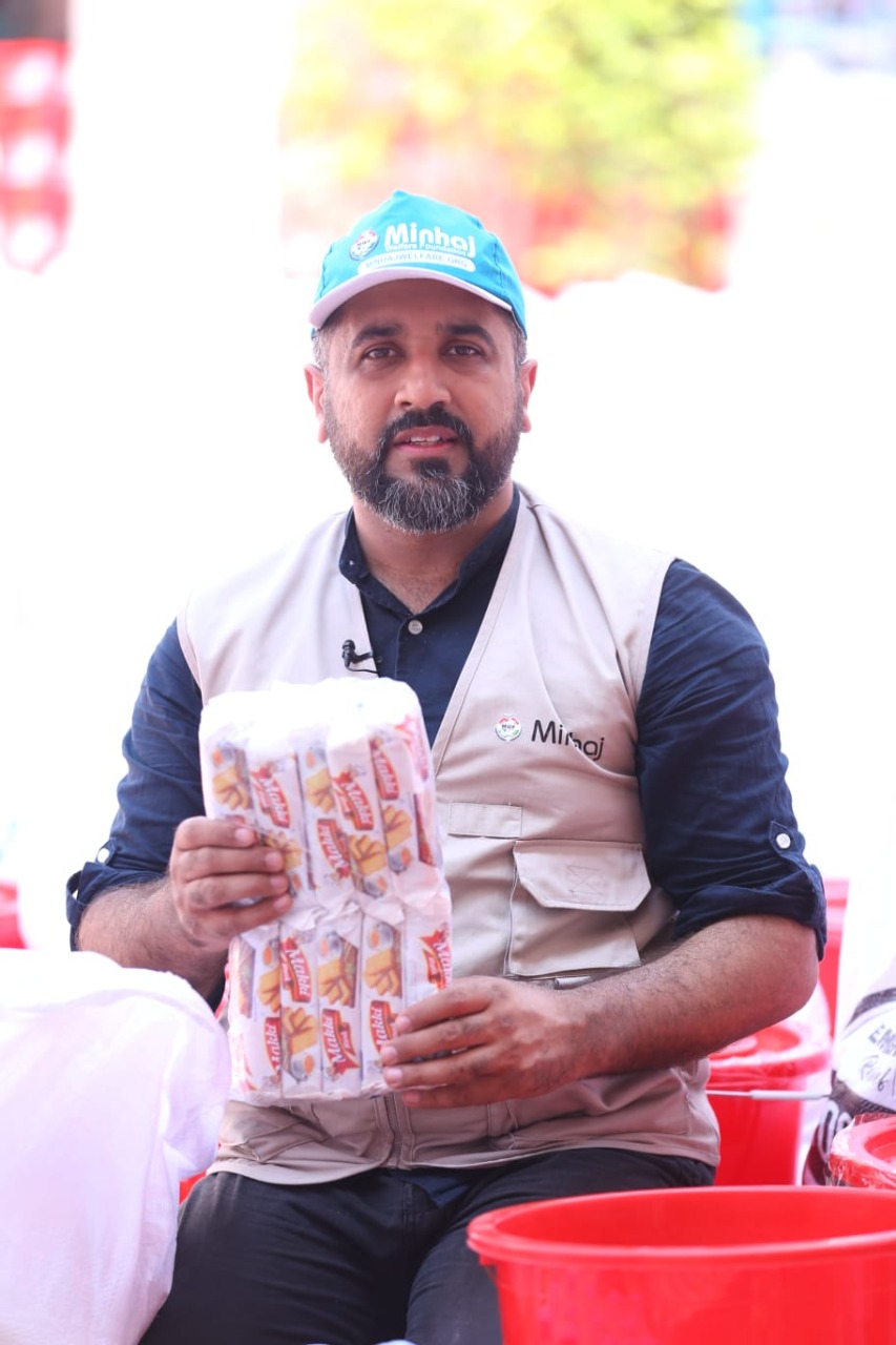 Minhaj Welfare Foundation distributing hygiene kits along with food bags in flood-hit areas