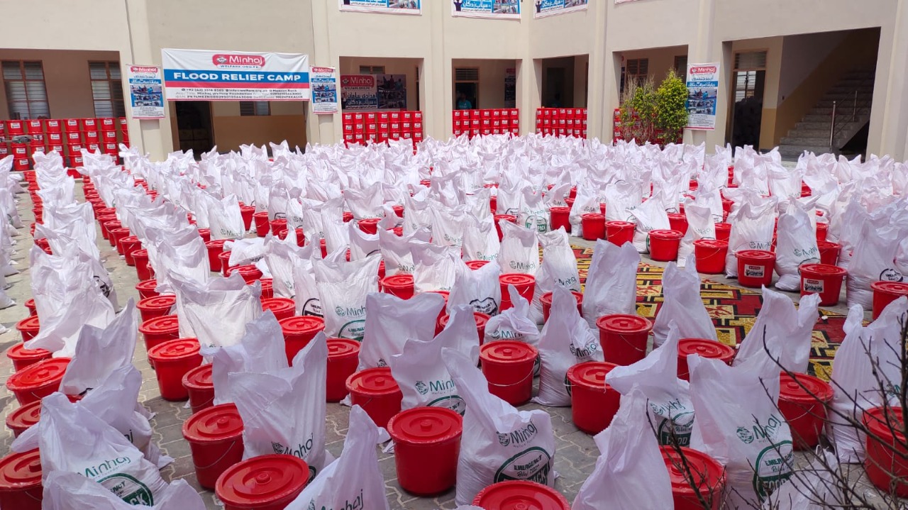 Minhaj Welfare Foundation distributing hygiene kits along with food bags in flood-hit areas