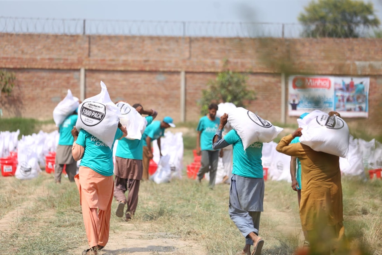 Minhaj Welfare Foundation distributing hygiene kits along with food bags in flood-hit areas