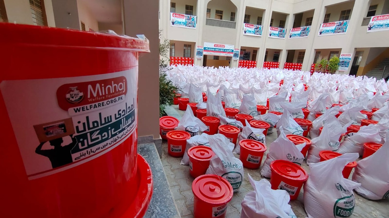 Minhaj Welfare Foundation distributing hygiene kits along with food bags in flood-hit areas