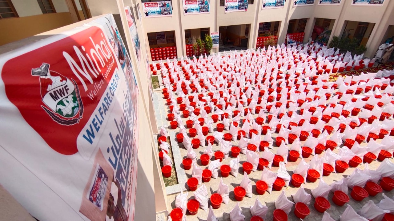 Minhaj Welfare Foundation distributing hygiene kits along with food bags in flood-hit areas