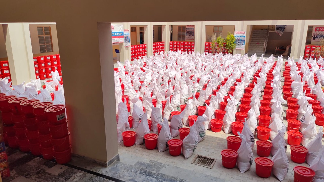 Minhaj Welfare Foundation distributing hygiene kits along with food bags in flood-hit areas