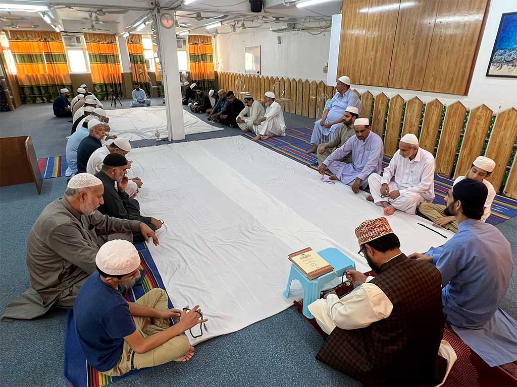 Conducting prayer ceremony at Minhaj ul Quran Islamic Center-hong kong