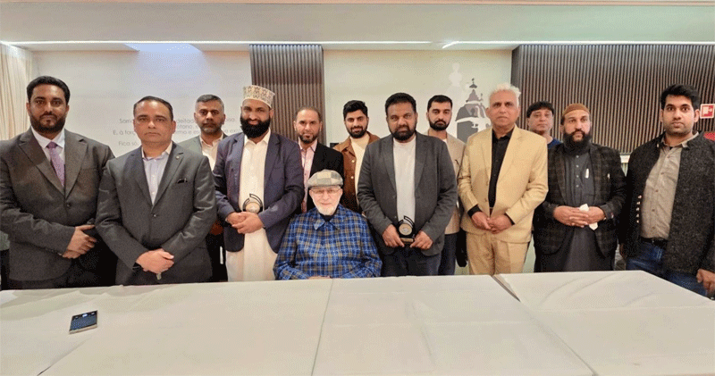 Shaykh ul Islam and Dr Hassan Qadri Giving Shields Exec Council Lisbon Portugal