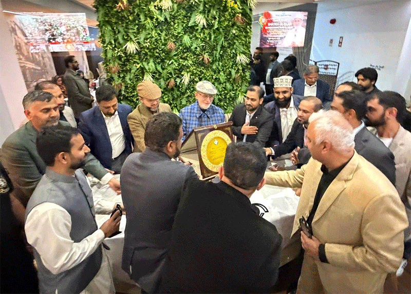 Shaykh ul Islam and Dr Hassan Qadri Giving Shields Exec Council Lisbon Portugal